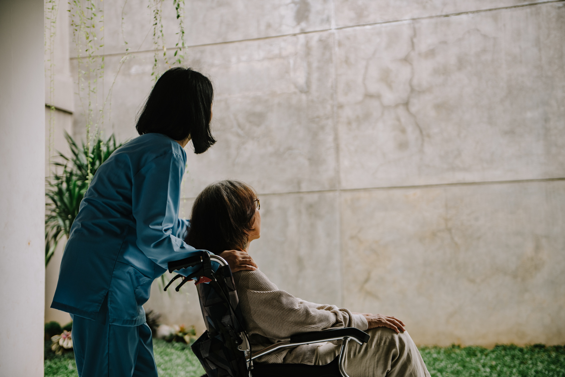 Nurse Taking Care of an Elderly Woman 